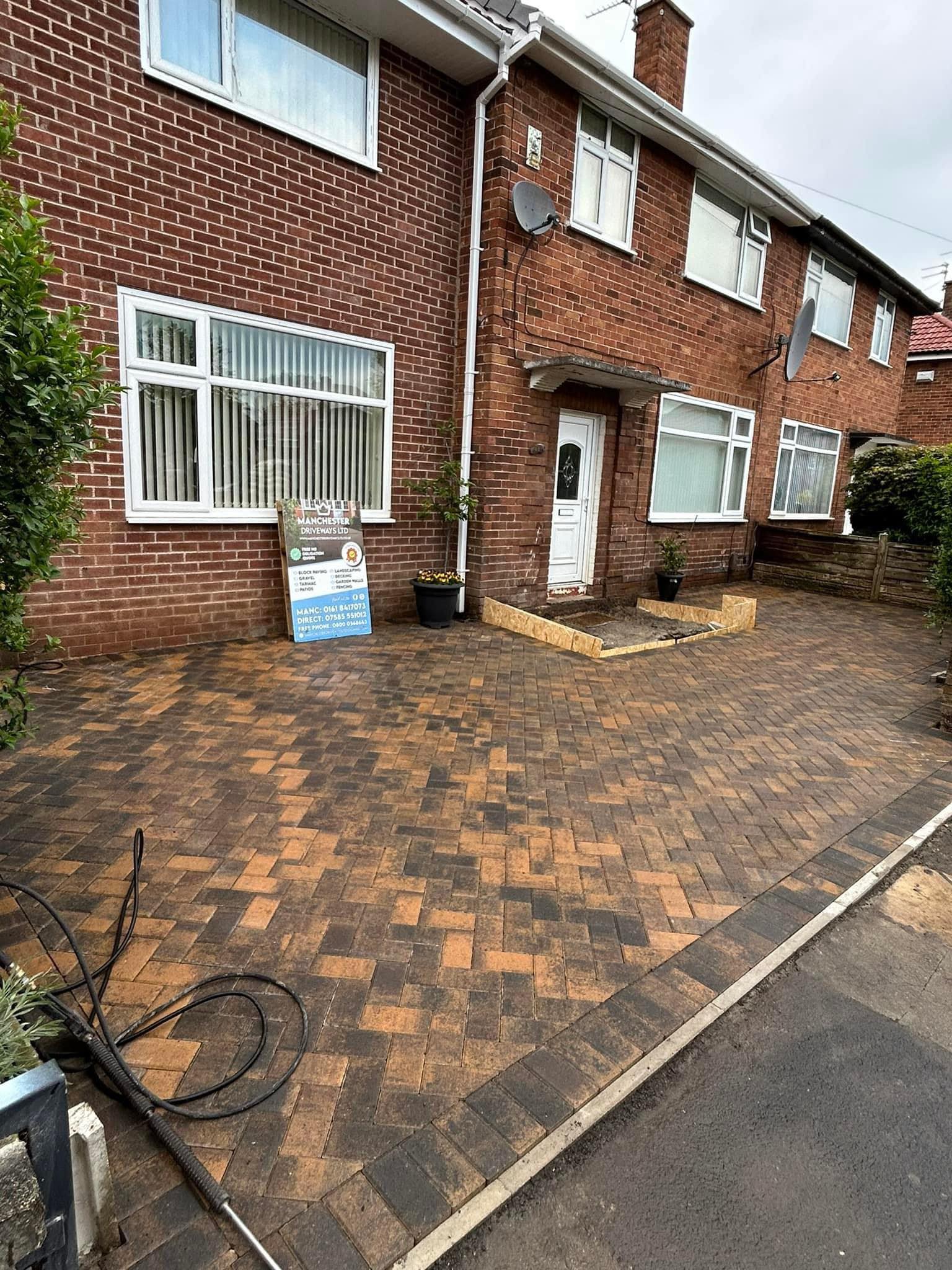 MOT Type 1 sub-base being compacted on a Manchester driveway